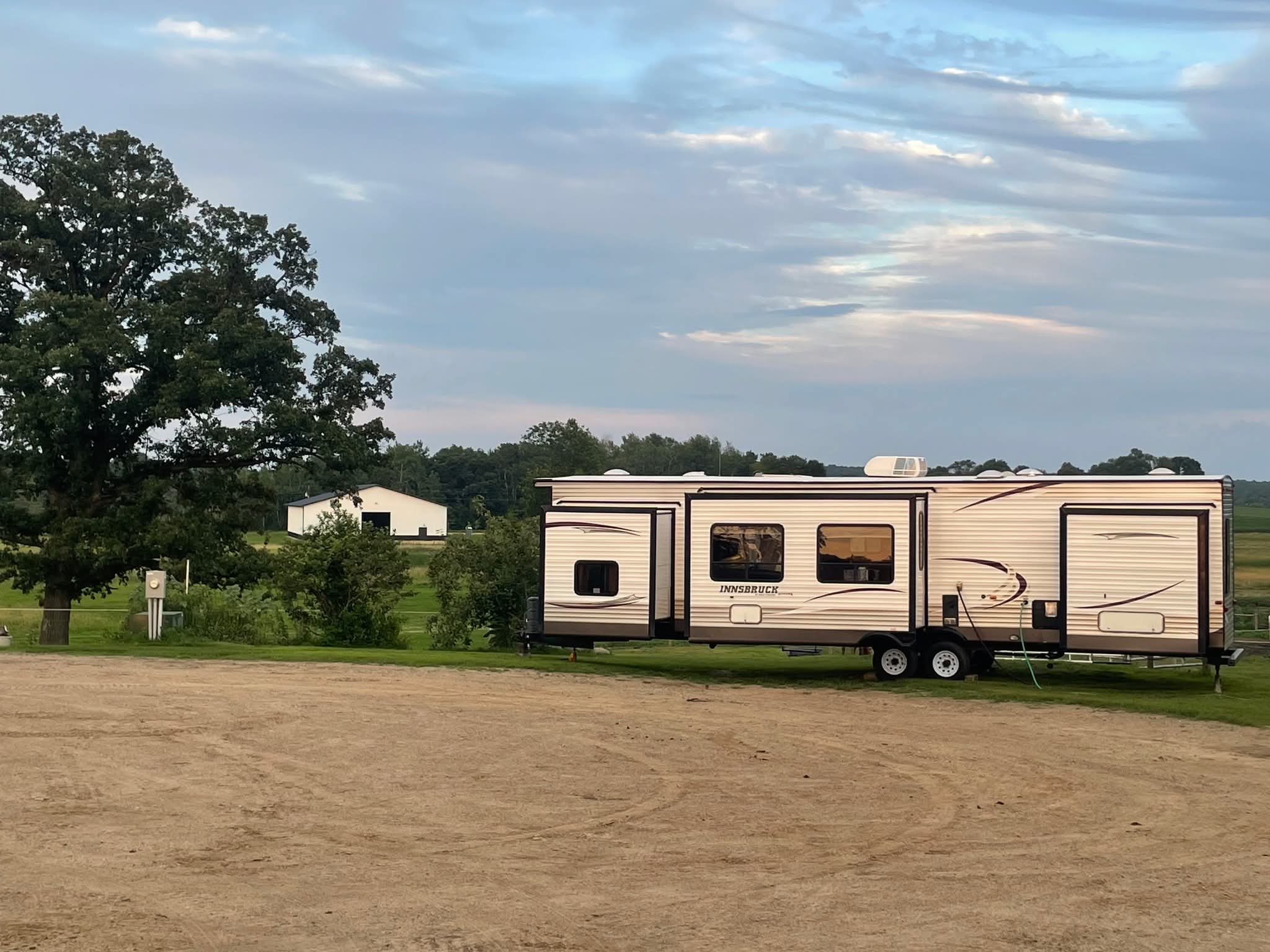 RV parked on site at dusk